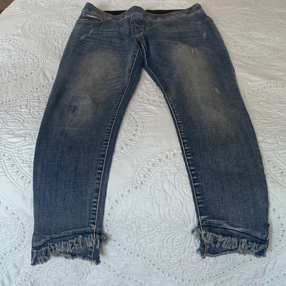 Straight leg ankle crossover fringe jeans.Comfortable smoothing fabric